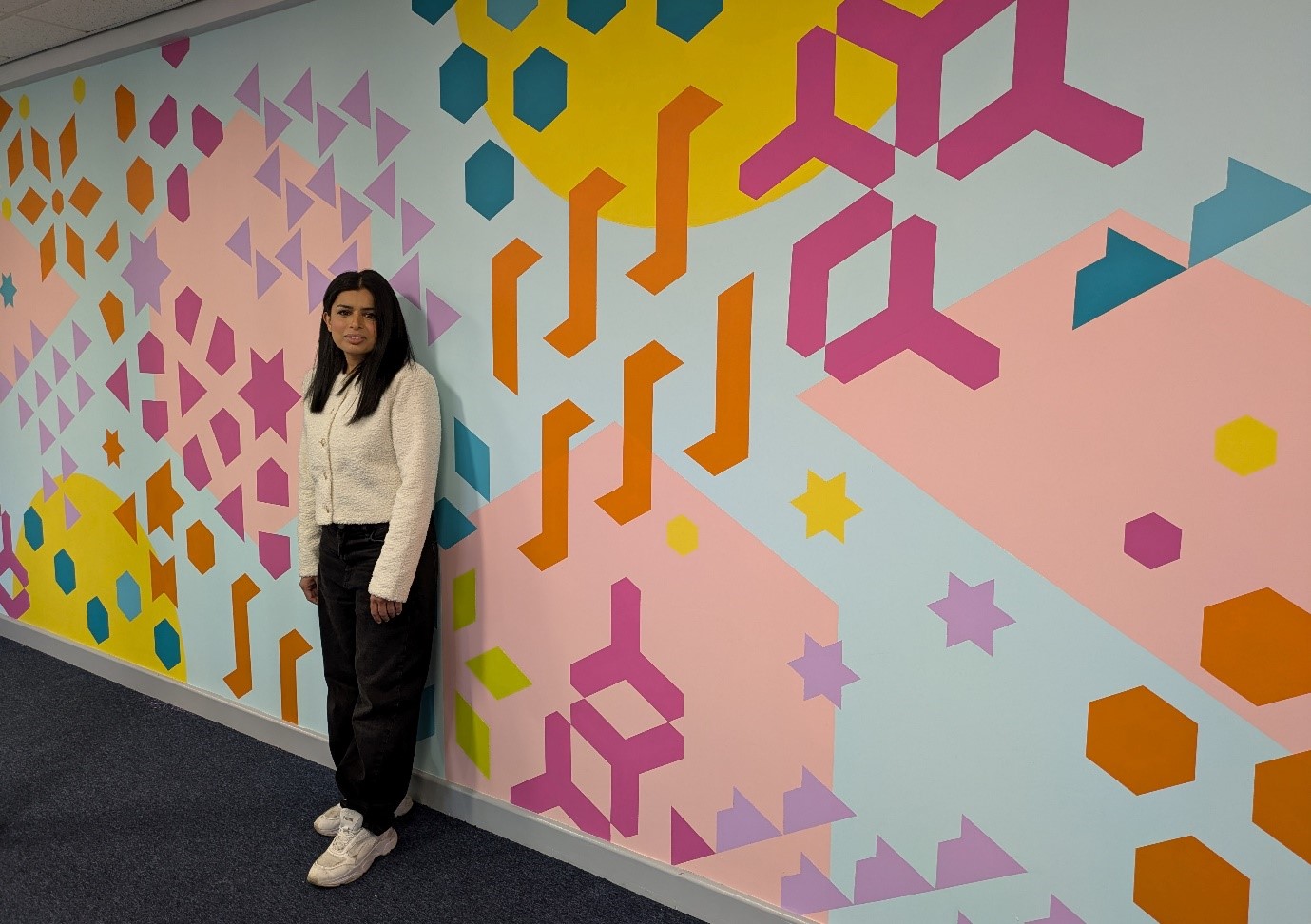 Artist pharmacist creates geometric hospital mural